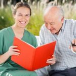 Home Care San Diego Caregiver Reading Book to Elder