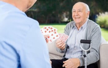 Senior Home Care San Diego Caregiver and Senior Playing Cards Brain Health