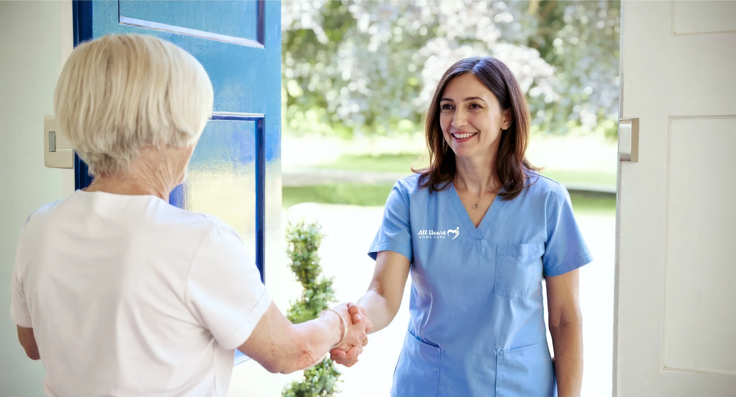 All Heart Home Care Caregiver Greeting Senior At Door In San Diego