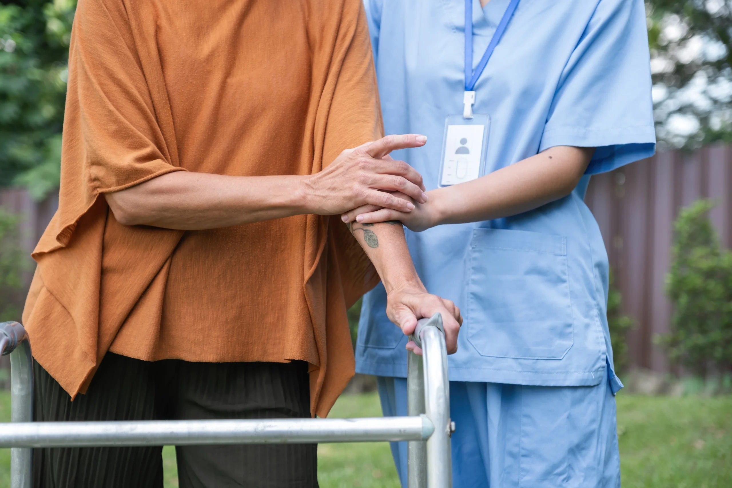 caregiver-assisting-elderly-woman-outdoors-focusi-2025-01-16-13-25-28-utc